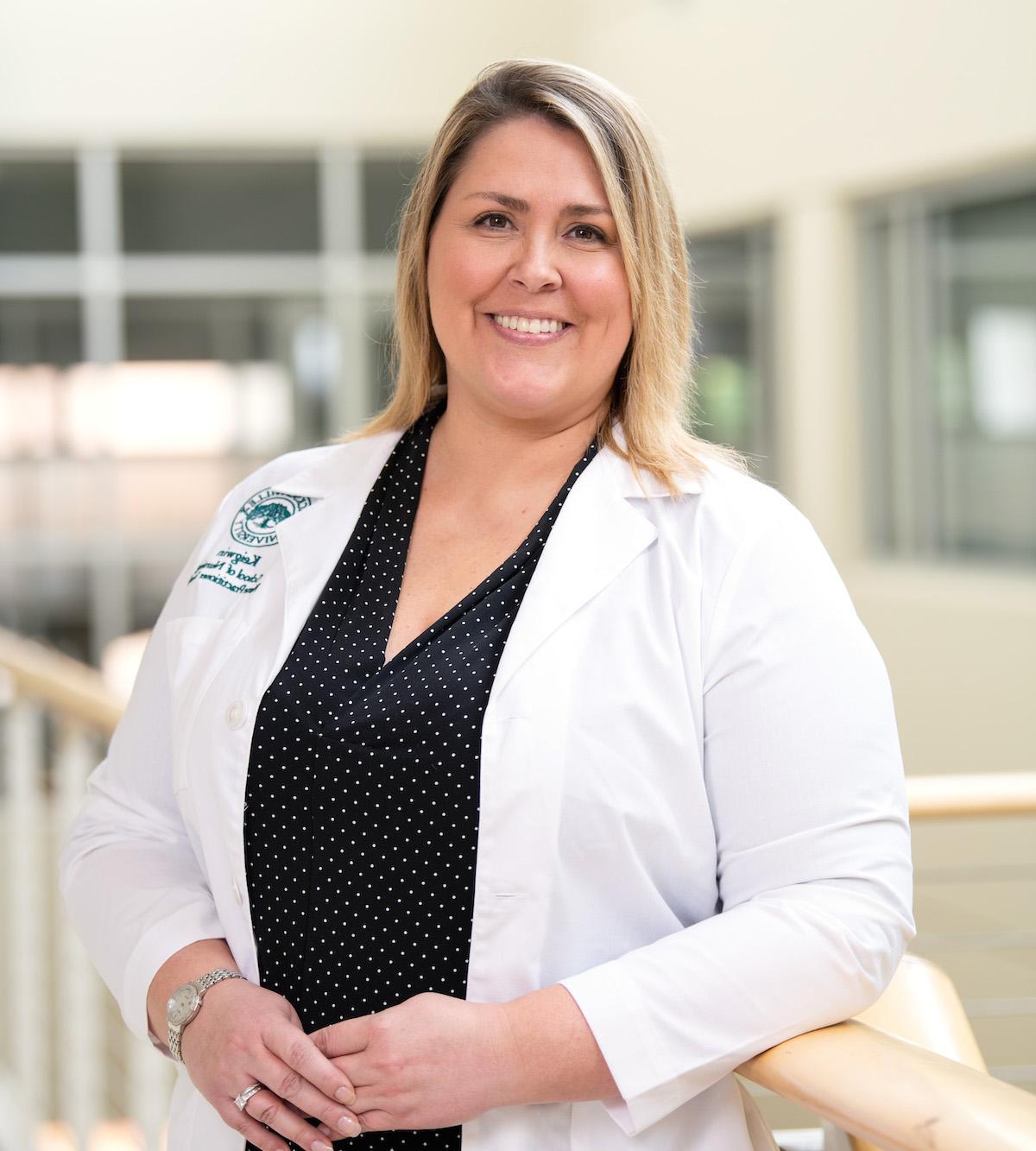 A nursing student looking at the camera for a photo.